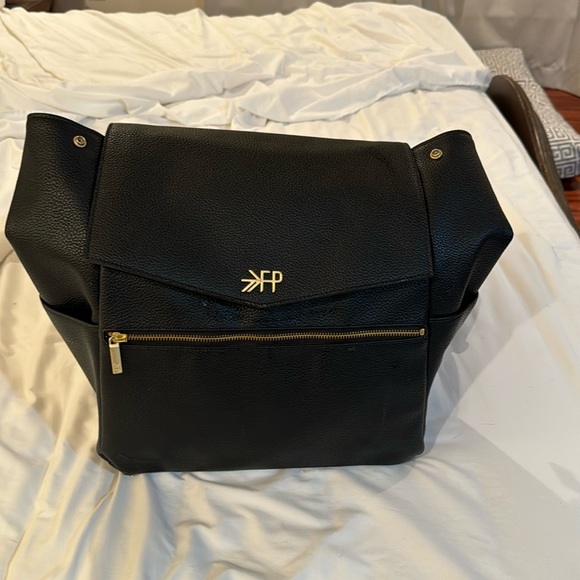 Freshly picked black leather diaper bag.